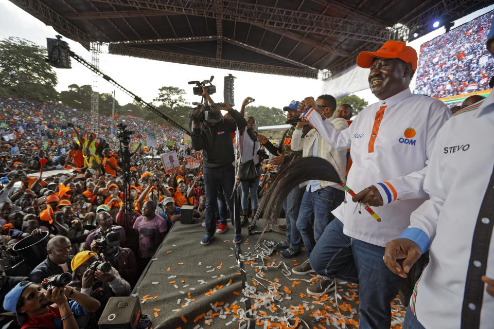 <p>Main opposition leader Raila Odinga, right, dances in front of his supporters at his final electoral campaign rally at Uhuru Park in Nairobi, Kenya, Saturday, Aug. 5, 2017. (Photo: Ben Curtis/AP) </p>