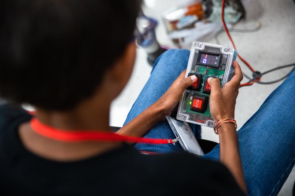 Seth DeSilva tests a remote controller for an underwater robot at a Baker Middle School robotics team meeting at the school on Friday, June 24, 2022. The team's robots will face off against others at a competition later in the year.