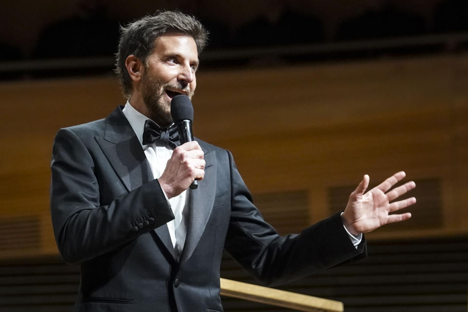 Actor and director Bradley Cooper speaks before the New York Philharmonic performance of Leonard Bernstein's music from his movie "Maestro," conducted by the Metropolitan Opera and philharmonic's new music director Yannick Nézet-Séguin, Wednesday, Feb. 14, 2024, in New York. (AP Photo/Bebeto Matthews)
