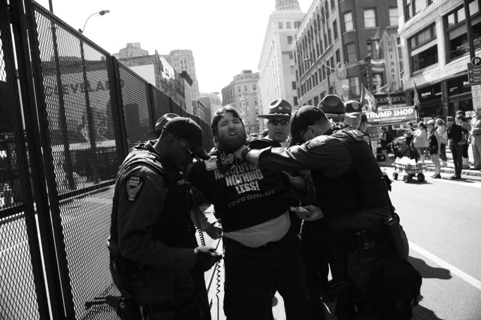 <p>Police detain a protester outside the convention center. (Photo: Khue Bui for Yahoo News)<br></p>