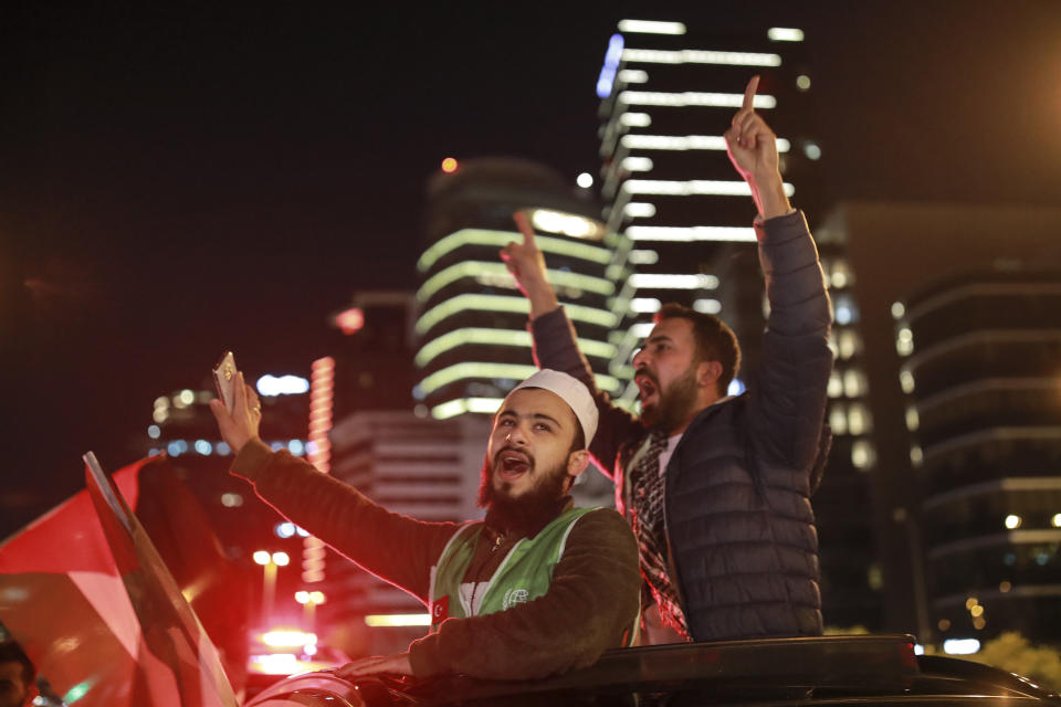 Protesters from IHH, a Turkish pro-Islamic organization chant anti-Israel slogans during a rally outside Israel's consulate in Istanbul, late Sunday, May 9, 2021, in support of Palestinians in the latest round of violence in Jerusalem. Dozens of Palestinians were wounded in violent confrontations with police in Jerusalem overnight from Saturday to Sunday. On Friday, more than 200 Palestinians were wounded in clashes at the Al-Aqsa Mosque compound and elsewhere in Jerusalem, drawing condemnations from Israel's Arab allies and calls for calm from the United States, Europe and the United Nations. (AP Photo/Emrah Gurel)