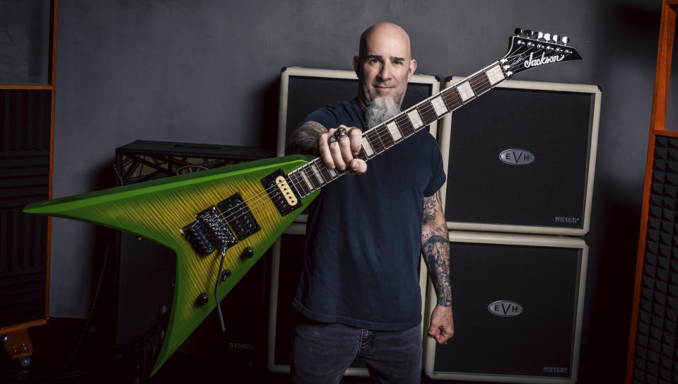  Scott Ian holds his latest Jackson signature King V guitar 