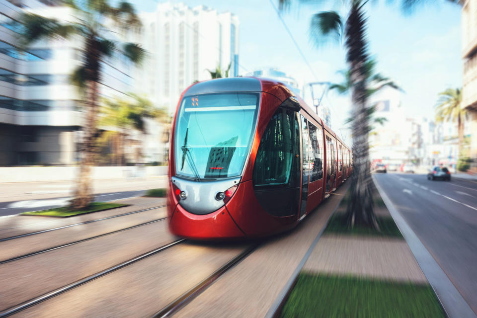 Blurred motion of cable car moving in city