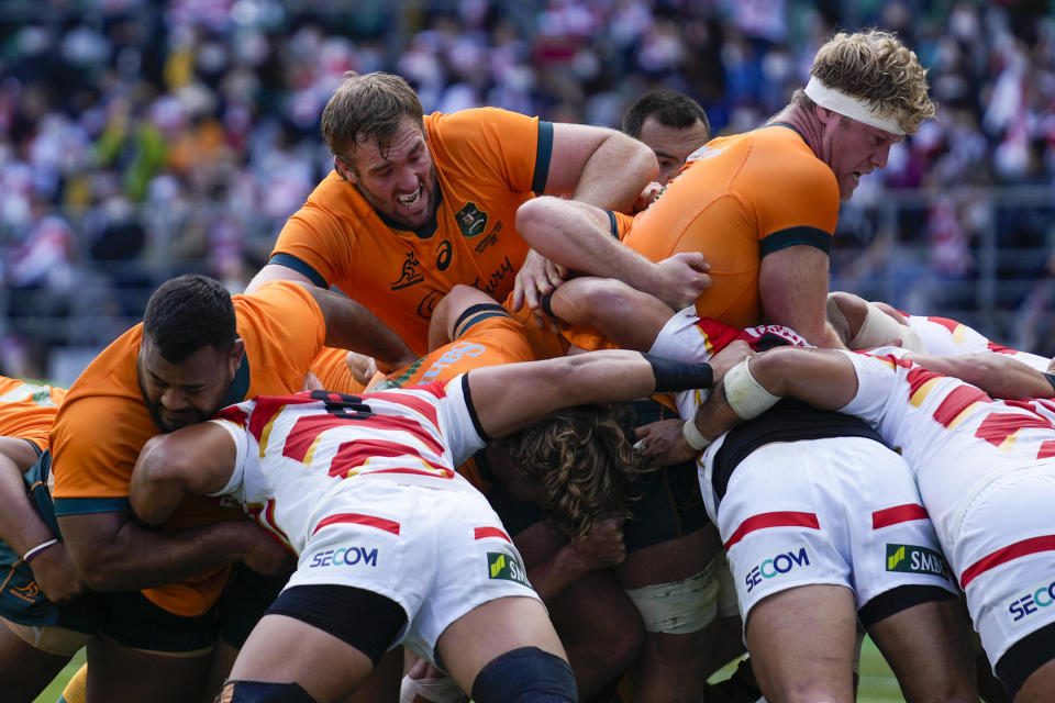 Australia's Taniela Tupou, left, Izack Rodda and Matt Philip compete in a maul during the rugby international between the Wallabies and Japan in Oita, Japan, Saturday, Oct. 23, 2021. (AP Photo/Hiro Komae)