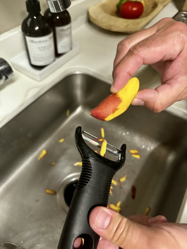 Peeling itty-bitty fingerlings for potato salad<p>Kelli Venner</p>