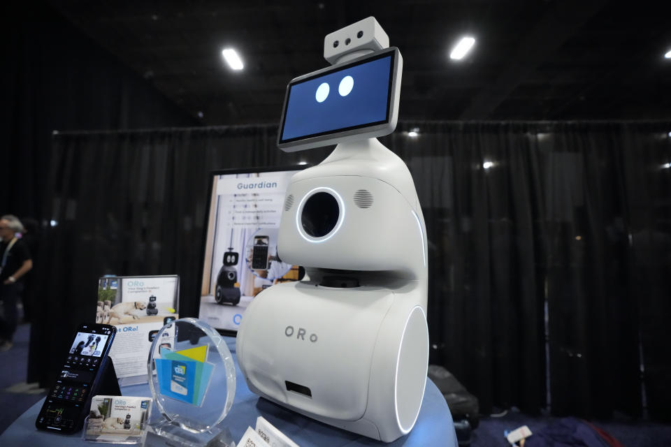 The ORo robot dog companion by is displayed during CES Unveiled before the start of the CES tech show Sunday, Jan. 7, 2024, in Las Vegas. The robot is designed to interact with, feed, and distribute medication for pets automatically. (AP Photo/Ryan Sun)