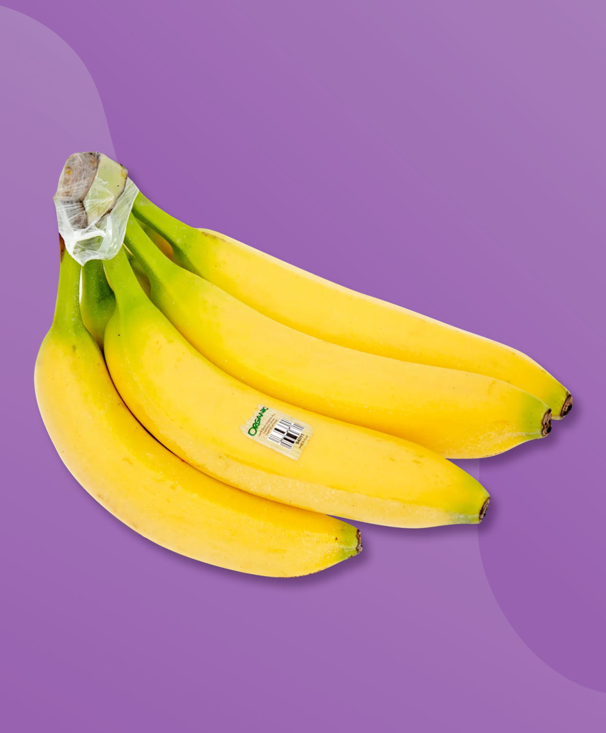 A hand of bananas on a purple background. (TODAY Illustration / Lauren Schatzman / Trader Joe's)