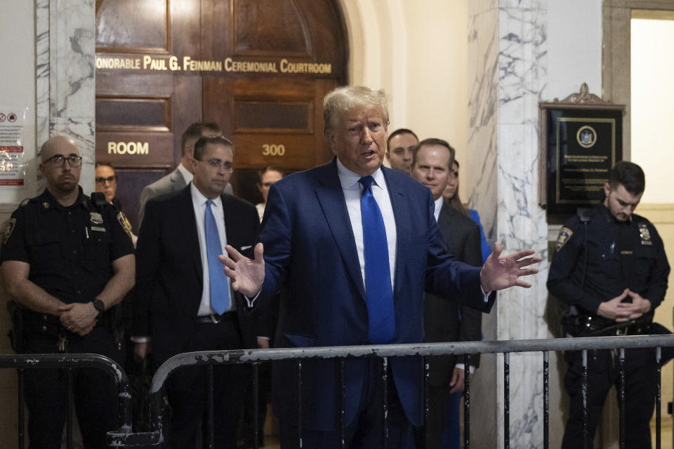 Former President Donald Trump speaks to the media as he exits courtroom in his civil business fraud trial at New York Supreme Court, Wednesday, Oct. 25, 2023, in New York. (AP Photo/Yuki Iwamura)