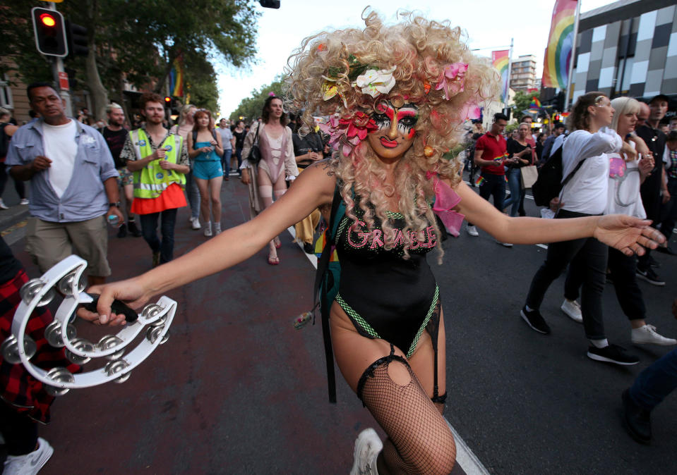 <p>A drag performer dances down the street as members of the gay community and their supporters celebrate the result of a postal survey calling for gay marriage right in Sydney, Australia, Wednesday, Nov. 15, 2017. (Photo: Rick Rycroft/AP) </p>