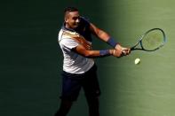 Sep 1, 2018; New York, NY, USA; Nick Kyrgios of Australia hits a backhand against Roger Federer of Switzerland (not pictured) in the third round on day six of the US Open at USTA Billie Jean King National Tennis Center. Mandatory Credit: Geoff Burke-USA TODAY Sports