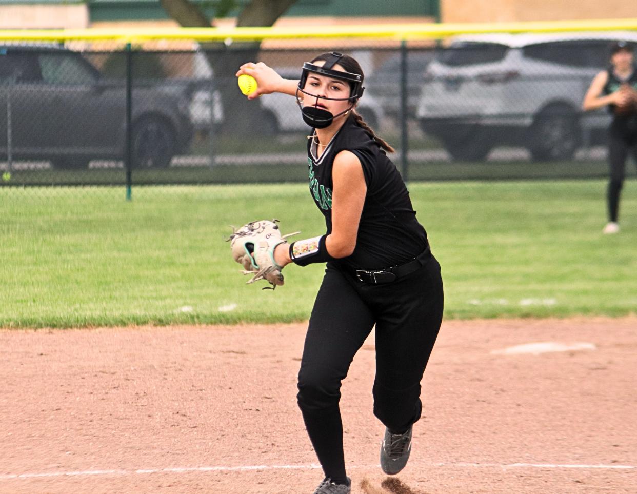 Dwight hurler Madi Ely delivers a pitch during the Trojans’ Tri-County Conference game with Putnam County.