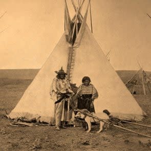 Indian Chief with his wife in front of their tent, historical photo, United states of America 2010s
