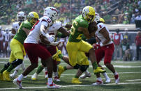 Oregon running back Travis Dye scores during the first quarter of an NCAA college football game against Fresno State, Saturday, Sept. 4, 2021, in Eugene, Ore. (AP Photo/Andy Nelson)