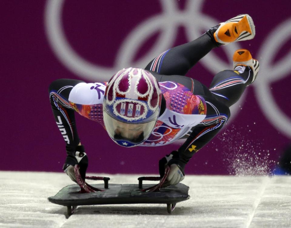 Noelle Pikus-Pace of the United States starts her final run during the women's skeleton competition at the 2014 Winter Olympics, Friday, Feb. 14, 2014, in Krasnaya Polyana, Russia. Pikus-Pace won the silver medal. (AP Photo/Natacha Pisarenko)