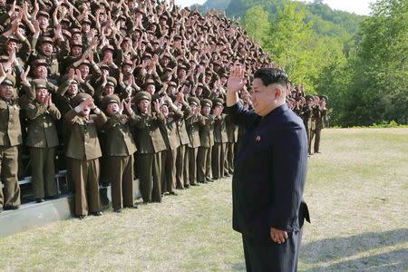 North Korean leader Kim Jong Un waves during an inspection at the commanding headquarters of the 264 Combined Forces, in this undated photo released by North Korea's Korean Central News Agency (KCNA) in Pyongyang on May 24, 2015. REUTERS/KCNA