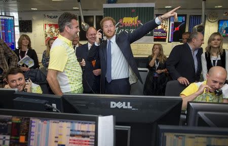 Britain's Prince Harry takes part in a charity trading day at ICAP with Edward Bird on the Interest Rate Swaps Desk in support of his charity Sentebale, in London, December 7, 2016. REUTERS/Geoff Pugh/Pool