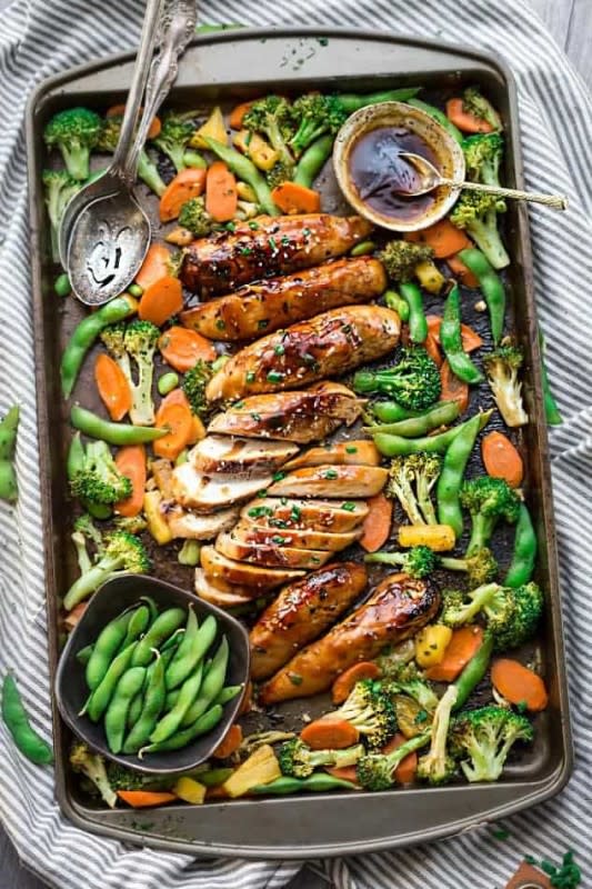 <p>Life Made Sweeter</p><p>This recipe is made entirely on one sheet pan with tender chicken, crispy vegetables and a delicious sweet and tangy Asian sauce.</p><p><strong>Get the recipe: </strong><a href="https://lifemadesweeter.com/one-pan-teriyaki-chicken/" rel="nofollow noopener" target="_blank" data-ylk="slk:One-Pan Teriyaki Chicken and Vegetables;elm:context_link;itc:0;sec:content-canvas" class="link "><strong>One-Pan Teriyaki Chicken and Vegetables</strong></a></p>