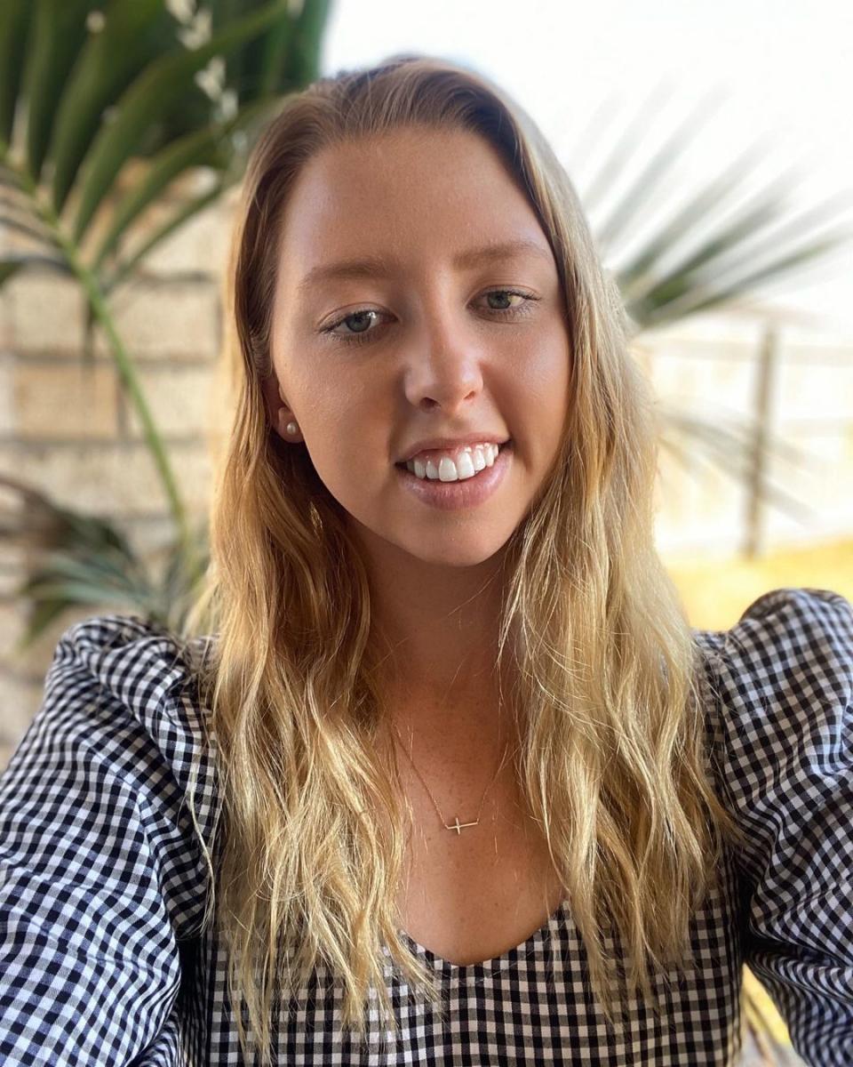 A selfie of Lakeisha 'Lucky' Patterson, Paralympic gold medallist, wearing a black and white gingham blouse