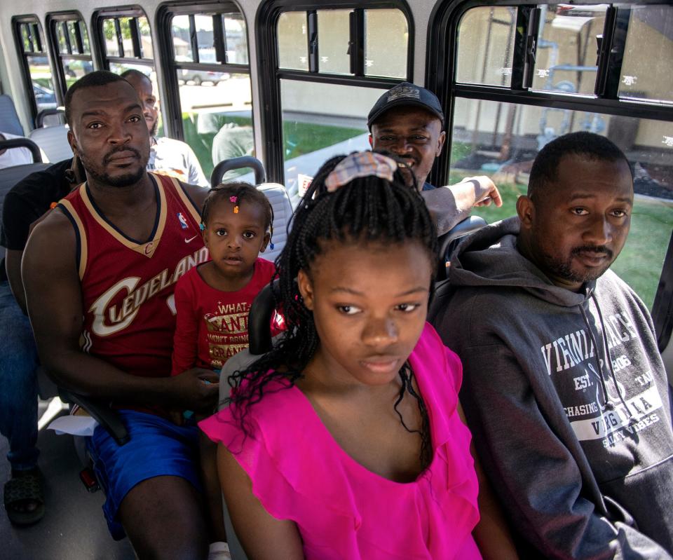 Haitian asylum seekers living at the Red Roof Inn in Framingham learned how to use the MetroWest Regional Transit Authority bus system, Aug. 31, 2023. Families were given pre-paid "catch cards" good for three months from the MWRTA.