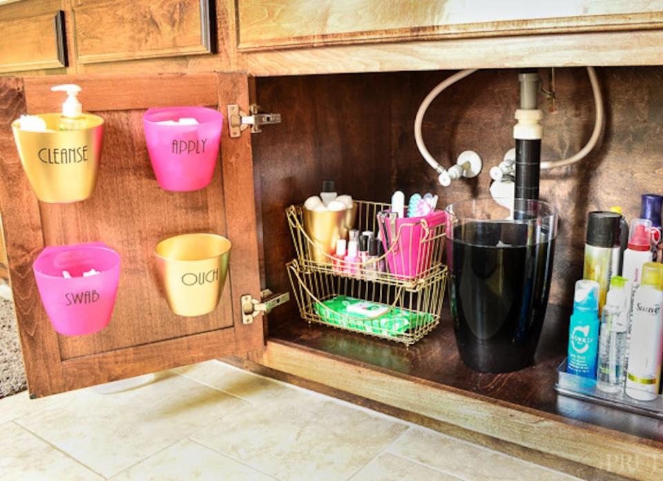 <body> <p>Create an inviting home for your under-the-sink cleaning companions simply by adding baskets and trays to the <a rel="nofollow noopener" href=" https://www.bobvila.com/slideshow/painted-cabinets-14-reasons-to-transform-yours-now-2359?bv=yahoo" target="_blank" data-ylk="slk:cabinet;elm:context_link;itc:0;sec:content-canvas" class="link ">cabinet</a> floor and caddies to the door. When filled with detergent and sponges, these chic compartments will make it a cinch to find what you need when you need it.</p> <p><strong>Related: <a rel="nofollow noopener" href=" http://www.bobvila.com/slideshow/9-handy-under-sink-organizers-to-buy-or-diy-48657#.Vrve_WTysy4?bv=yahoo" target="_blank" data-ylk="slk:9 Handy Under-Sink Organizers to Buy or DIY;elm:context_link;itc:0;sec:content-canvas" class="link ">9 Handy Under-Sink Organizers to Buy or DIY</a> </strong> </p> </body>