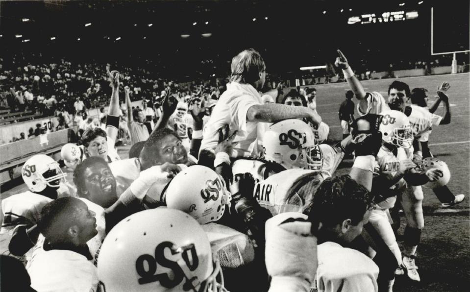 After riding roughshod over Arizona State for a 45-3 win, Oklahoma State football players carry first-year head coach Pat Jones off the field on Sept. 8, 1984, in Tempe, Ariz.
