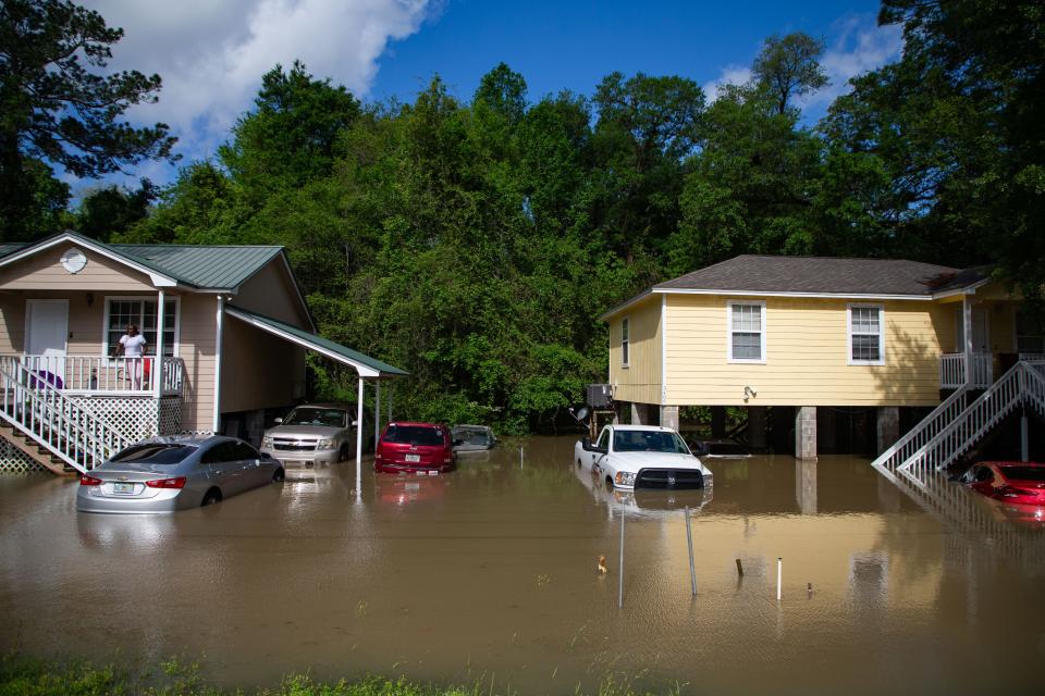 Residents who live in two homes on Ridge Road are trapped due to floodwater left behind after torrential rain on Thursday, April 11, 2024.