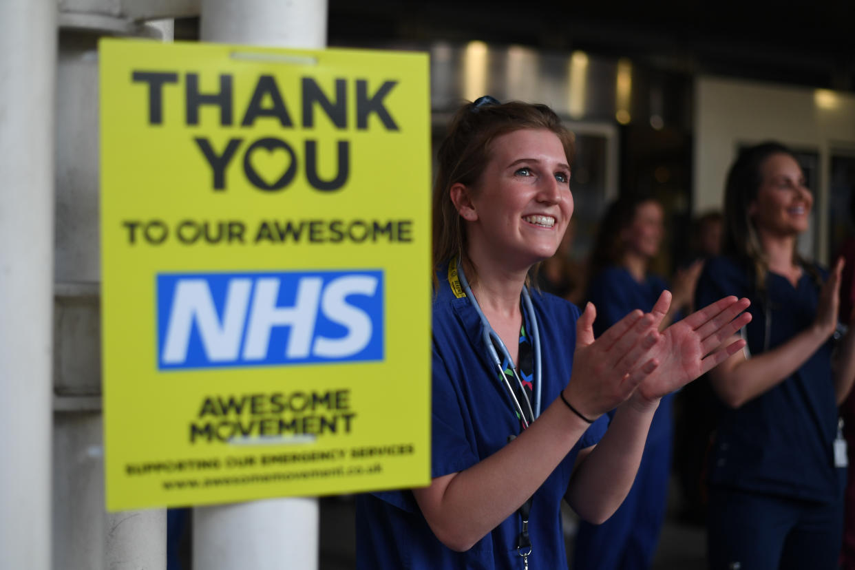 Medical staff outside the Chelsea and Westminster Hospital taking part in Clap for Carers in May. (PA)