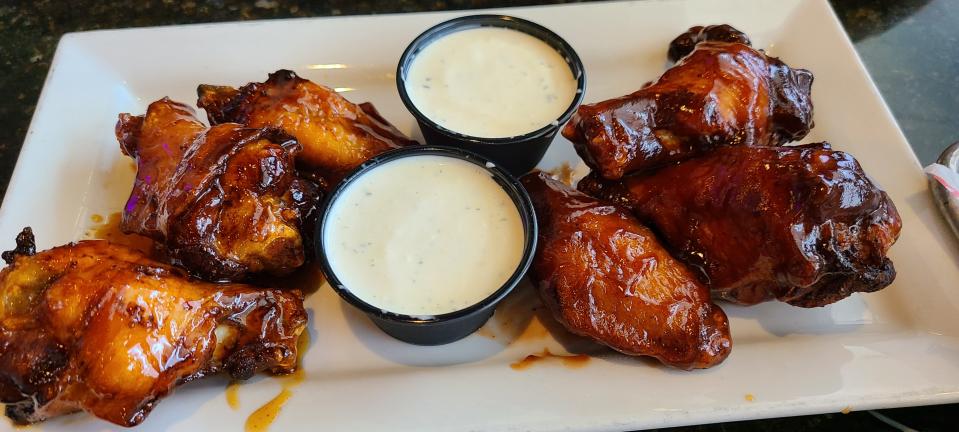 Midnight Tavern's mix and match wings. Honey (L) and barbecue (R), $11.