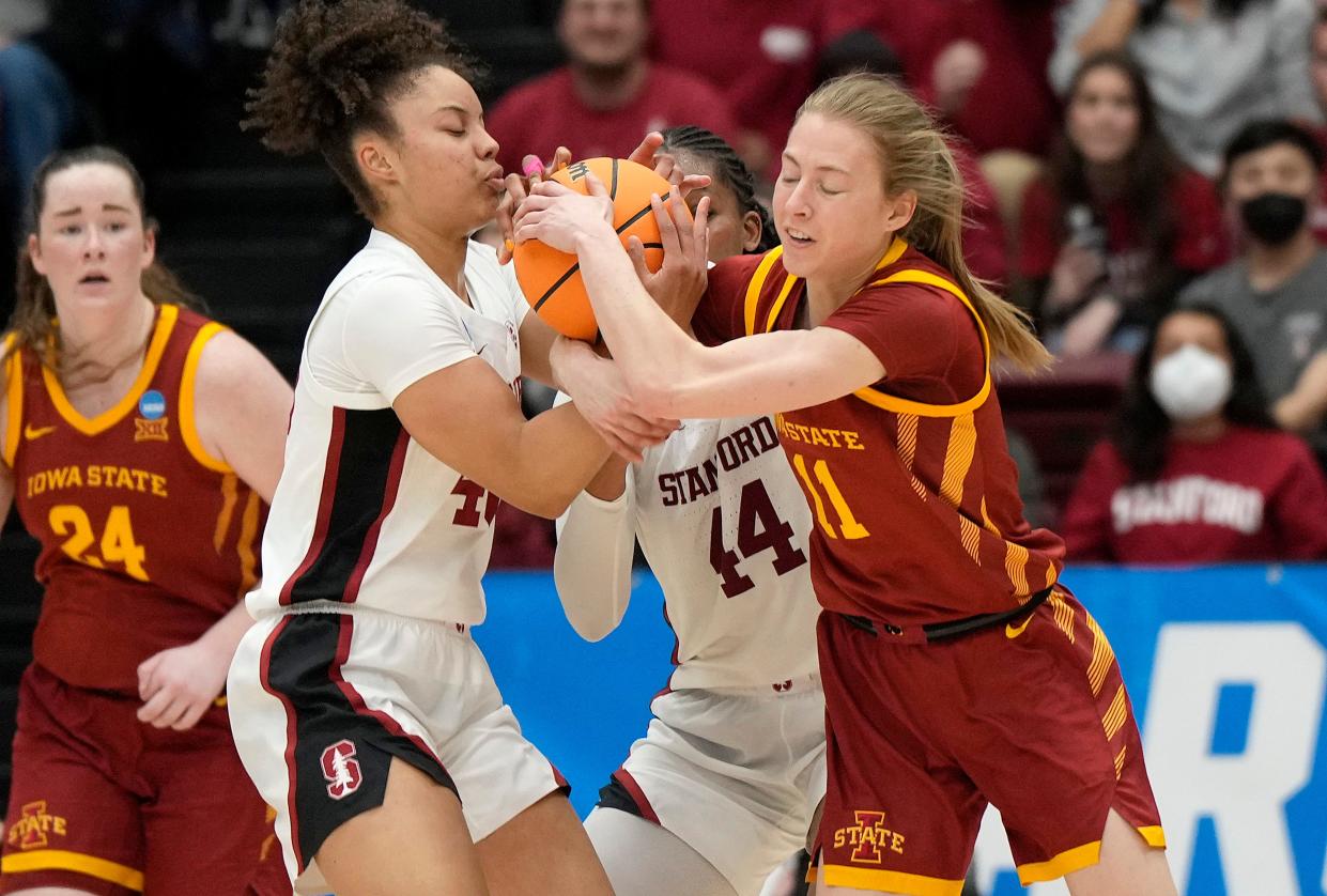Iowa State's Emily Ryan fights for the ball with Stanford's Courtney Ogden in the first half Sunday.