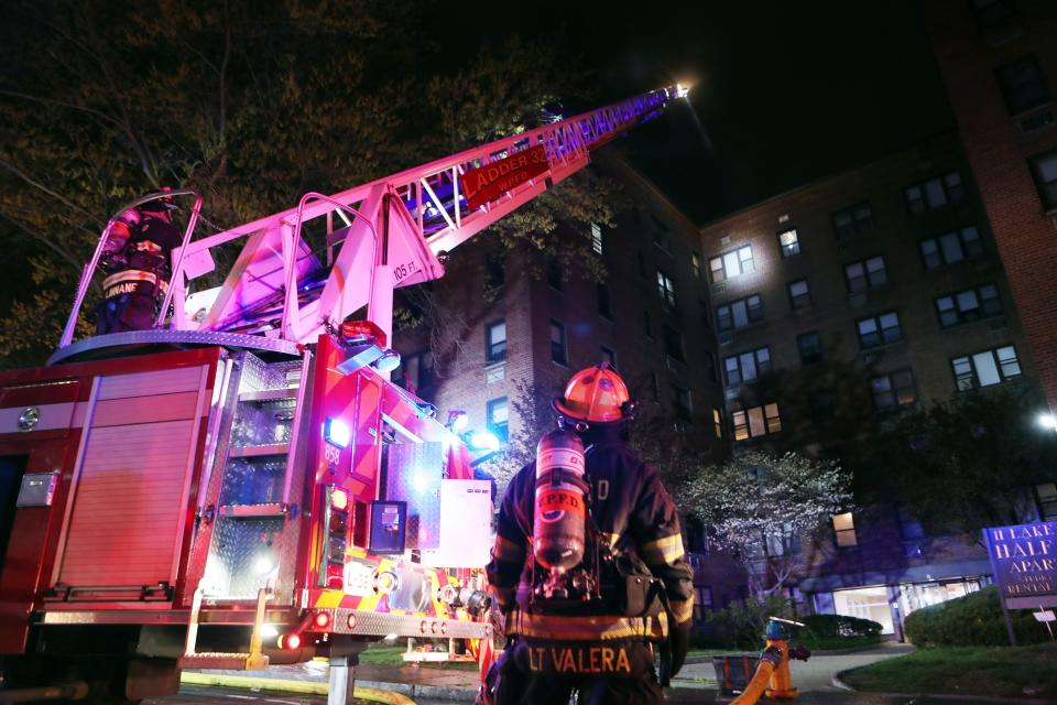 White Plains firefighters work at the scene of a fire in an apartment building at 11 Lake Street  in White Plains April 18, 2023. The fire broke out shortly after midnight, injuring  several residents and leaving dozens homeless.