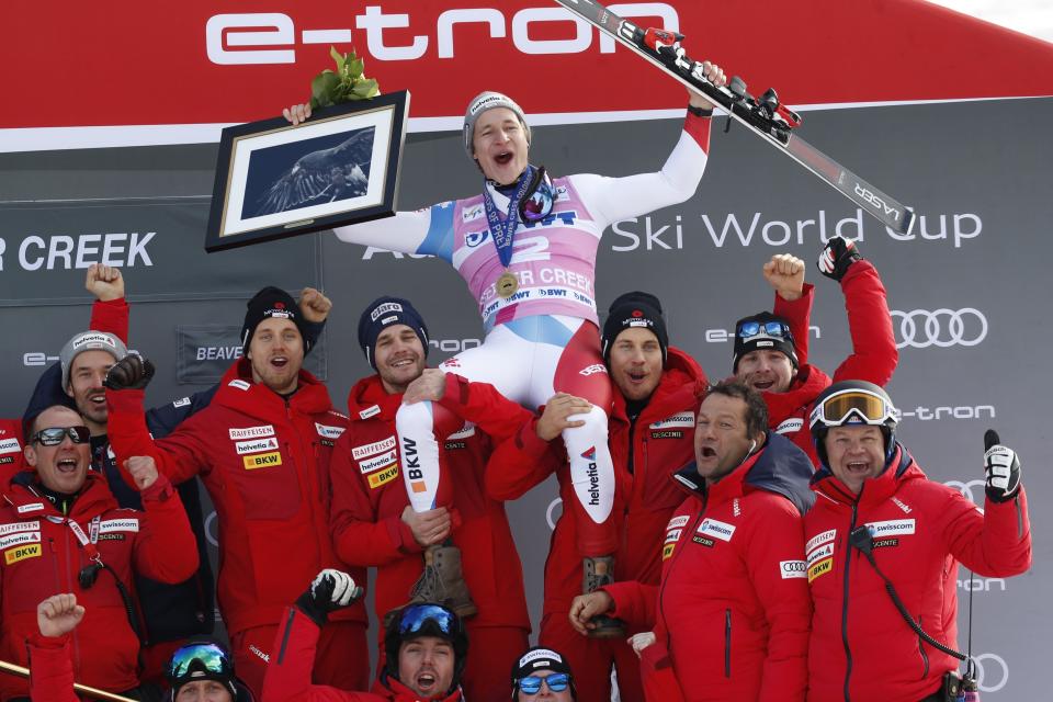Switzerland's Marco Odermatt celebrates with teammates after he won the Men's World Cup super-G skiing race Friday, Dec. 6, 2019, in Beaver Creek, Colo. (AP Photo/John Locher)