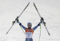 FILE - United States' Ted Ligety celebrates after winning the gold medal in the men's giant slalom at the Sochi 2014 Winter Olympics in Krasnaya Polyana, Russia, in this Wednesday, Feb. 19, 2014, file photo. Two-time Olympic champion Ted Ligety says he will retire from World Cup ski racing after the world championships. Ligety’s final race will be the giant slalom on Feb. 19 in Cortina d’Ampezzo, Italy. (AP Photo/Charlie Riedel, File)