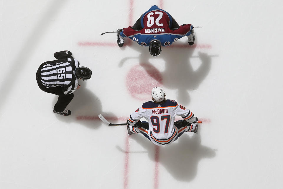 DENVER, CO - DECEMBER 11: Nathan MacKinnon #29 of the Colorado Avalanche faces off against Connor McDavid #97 of the Edmonton Oilers at the Pepsi Center on December 11, 2018 in Denver, Colorado. The Oilers defeated the Avalanche 6-4.  (Photo by Michael Martin/NHLI via Getty Images)