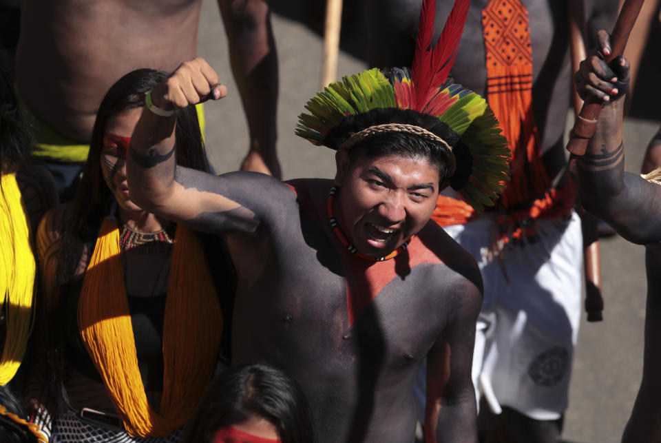 FILE - Indigenous people march during the 20th annual Free Land Indigenous Camp in Brasilia, Brazil, April 23, 2024. Thousands of Indigenous people continue to march on Thursday, April 25, calling on the government to officially recognize lands they have lived on for centuries and to protect territories from criminal activities like illegal mining. (AP Photo/Luis Nova, File)