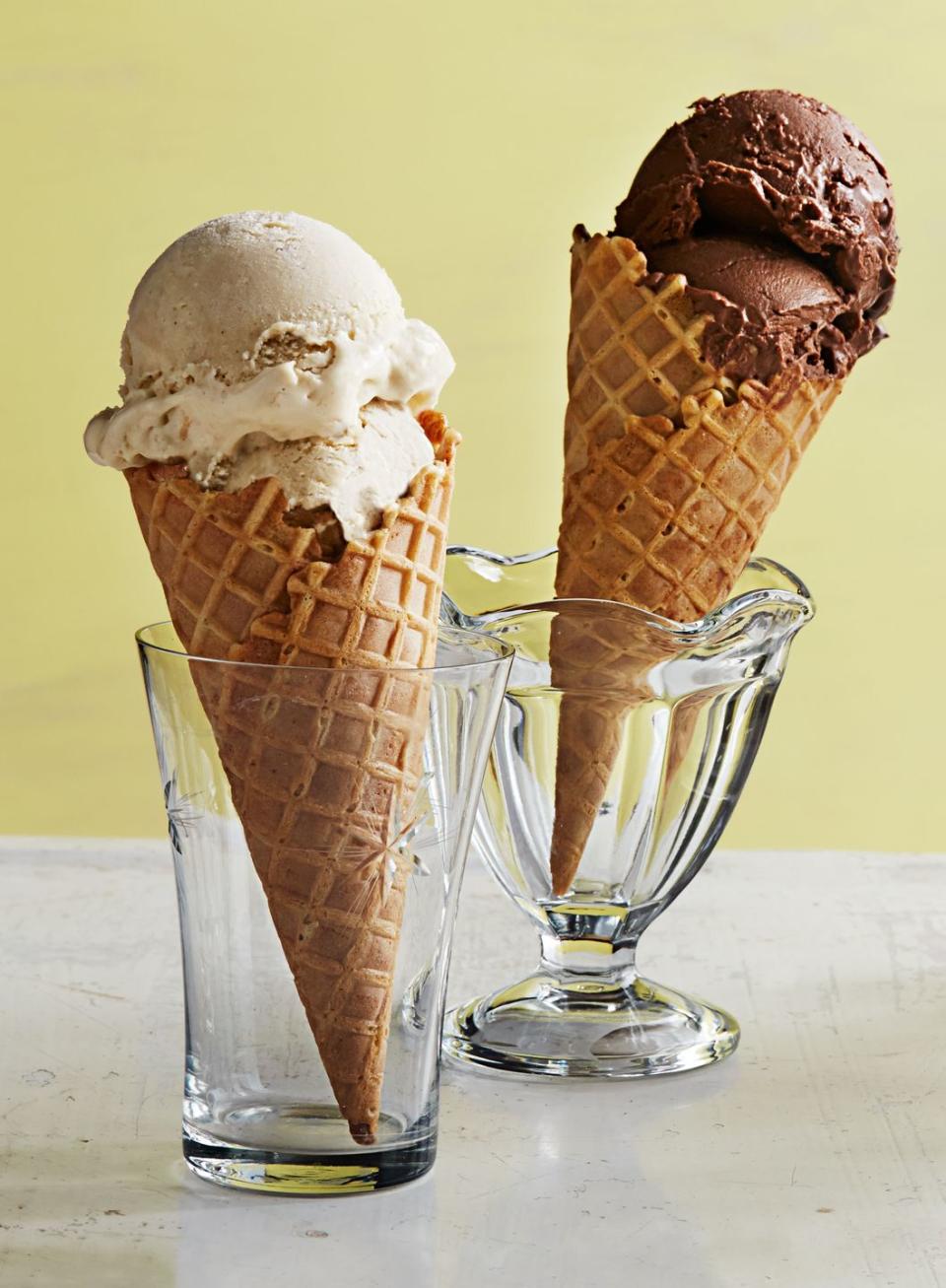 indulgent gelato in waffle cones sitting in glass cups