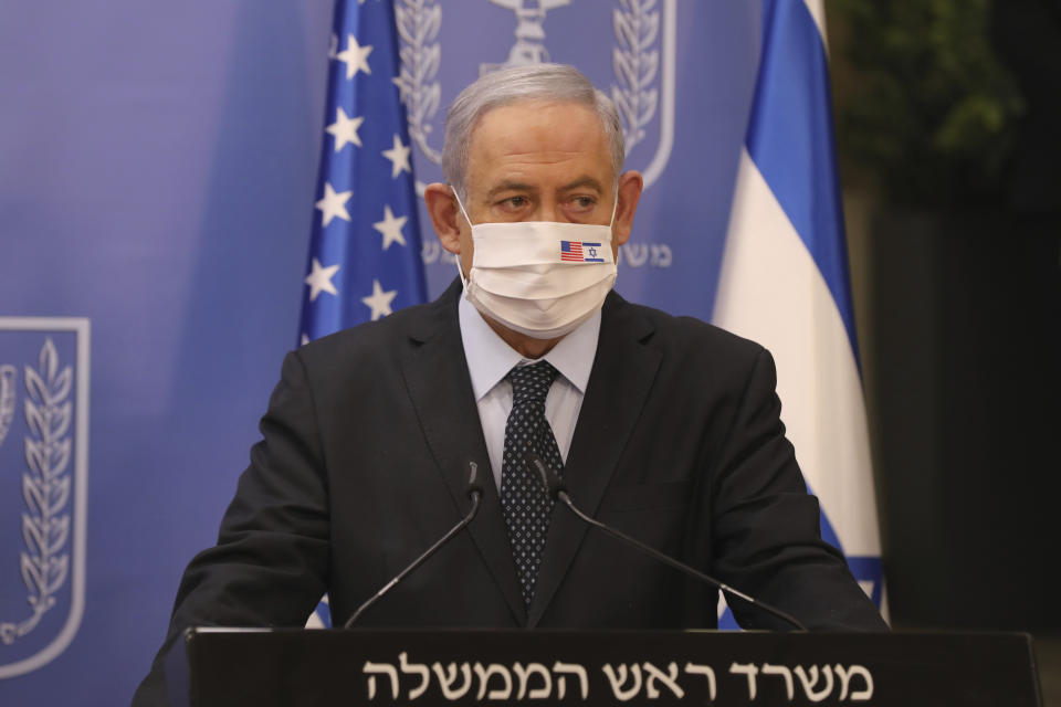 Israeli Prime Minister Benjamin Netanyahu wears a face mask during a media statement with US special envoy for Iran, Brian Hook, at the Prime Minister's office in Jerusalem, Tuesday June 30, 2020. (Abir Sultan/Pool via AP)