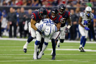 <p>Eric Ebron #85 of the Indianapolis Colts catches a pass tackled by Dylan Cole #51 and Justin Reid #20 of the Houston Texans in the first quarter during the Wild Card Round at NRG Stadium on January 5, 2019 in Houston, Texas. (Photo by Bob Levey/Getty Images) </p>