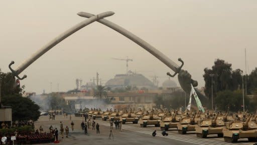 Iraqi army MIA1 Abrams tanks roll under the victory Arch landmark during an Army Day parade in Baghdad in January. Iraq has cancelled a $4.2 bn package of arms deals with Russia over corruption concerns, a spokesman for Prime Minister Nuri al-Maliki said on Saturday