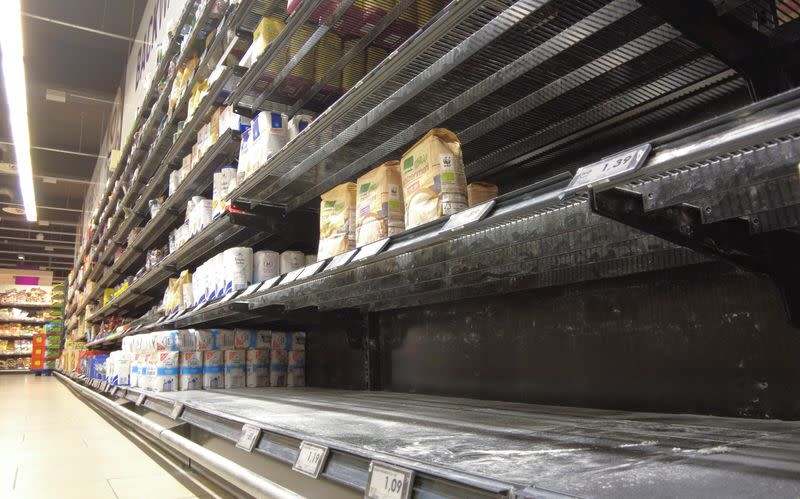 An almost empty supermarket shelf in Bonn