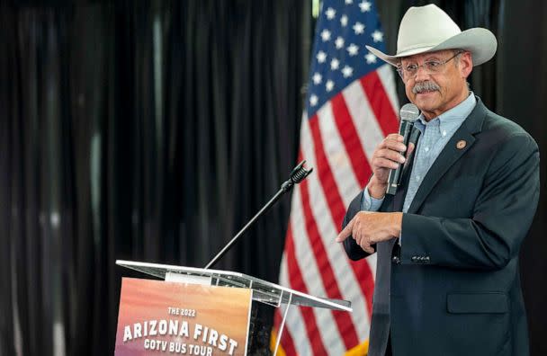 PHOTO: Mark Finchem, candidate for Secretary of State of Arizona, speaks during a rally with Republican nominee for governor of Arizona Kari Lake at Dream City Church in Phoenix, Ariz., on Nov. 7, 2022, on the eve of the US midterm elections. (Olivier Touron/AFP via Getty Images)