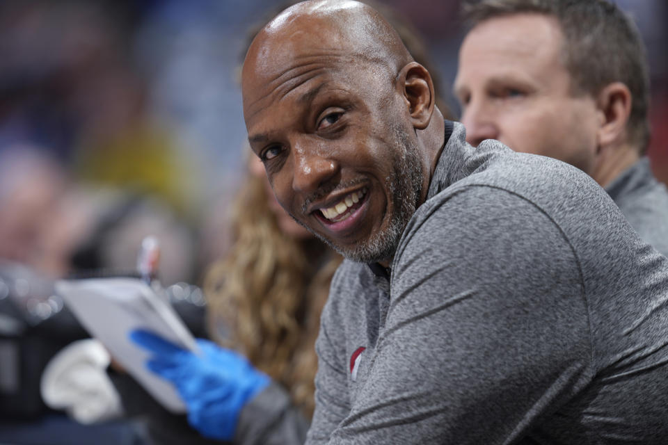 Portland Trail Blazers coach Chauncey Billups smiles near the end of the team's NBA basketball game against the Denver Nuggets on Tuesday, Jan. 17, 2023, in Denver. (AP Photo/David Zalubowski)