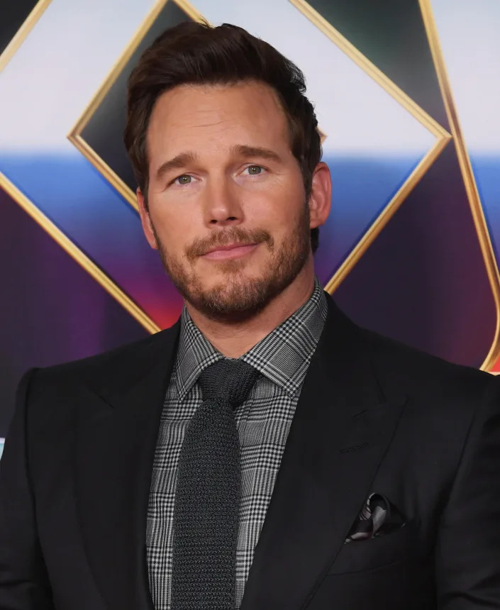 Close-up of Chris in a suit and tie