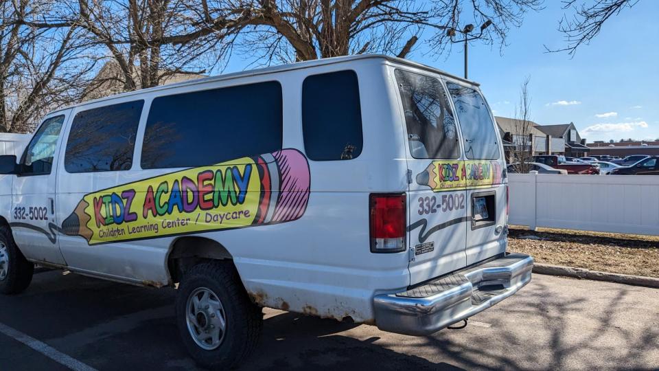 Kidz Academy van with former name and logo outside the daycare building Thursday, Feb. 22, 2024.