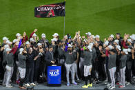 The Arizona Diamondbacks celebrate their win against the Philadelphia Phillies in Game 7 of the baseball NL Championship Series in Philadelphia Tuesday, Oct. 24, 2023. (AP Photo/Matt Rourke)