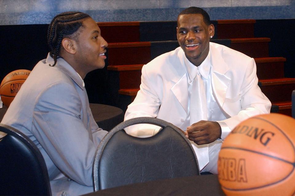 LeBron James, right, chats with Carmelo Anthony as they attend the 2003 NBA Draft on June 26, 2003, in New York.