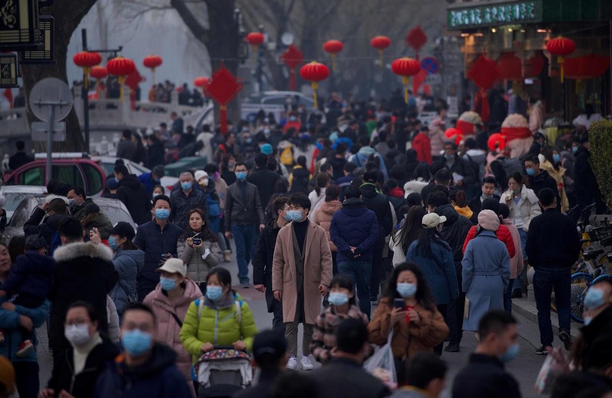 <p>File image: People flock to Houhai lake in Beijing on 12 February, 2021, the first day of the Lunar New Year</p> (AFP via Getty Images)