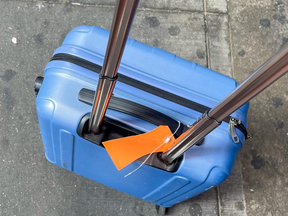 My luggage next to my foot.