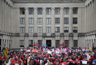 Protesters rally against benefit cuts in Trenton, N.J., Thursday, June 13, 2019. Spurred on by a tweet from U.S. Sen. Bernie Sanders, thousands of union members crowded around New Jersey's legislative annex Thursday, even spilling into the street, to protest state Senate President Steve Sweeney's calls to cut some worker benefits. (AP Photo/Seth Wenig)