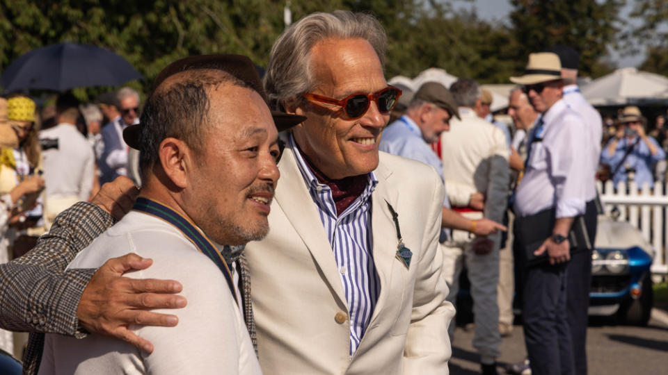 The 11th Duke of Richmond, Charles Gordon-Lennox, poses with attendees at the 2023 Goodwood Revival.