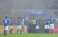 Football Soccer - Italy v Albania - World Cup 2018 Qualifiers - Group G - Renzo Barbera stadium, Palermo, Italy - 24/3/17. Italy's players leave the pitch as the referee suspends the match after Albania's supporters lit flares. REUTERS/Alberto Lingria